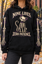 Black Nine Lives Zero Patience hoodie worn outdoors showing chest and sleeve artwork — digital mockup